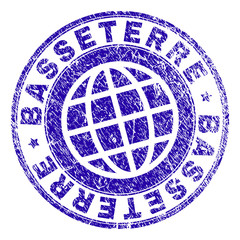 BASSETERRE stamp imprint with grunge style. Blue vector rubber seal imprint of BASSETERRE label with retro texture. Seal has words placed by circle and globe symbol.