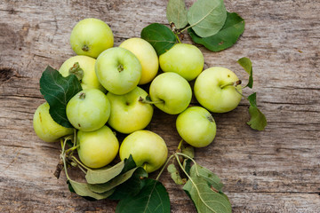 Fresh ripe apples on rustic wooden table