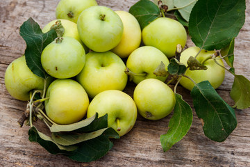 Fresh ripe apples on rustic wooden table