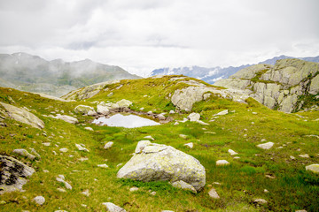 Fototapeta premium A mountain wasteland with stones in the clouds