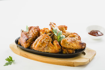 chicken wings with sesame on white background