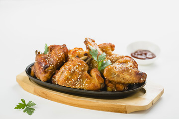 chicken wings with sesame on white background