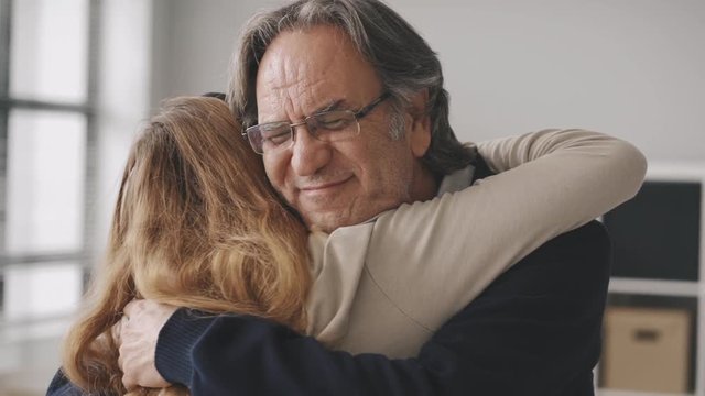 Girl hugging her father with love