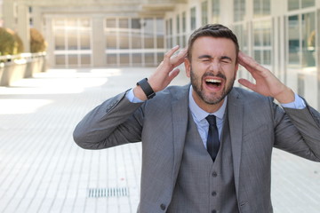 Businessman laughing really hard at work