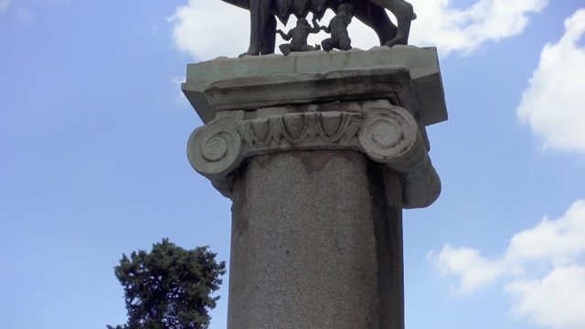 Statue of she-wolf on Capitoline hill in slow motion. Twins founders of Rome city - Romulus and Remus - suckling she-wolf. Icon of Italian capital Rome city