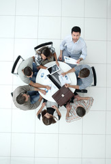 top view.employees work with financial documents