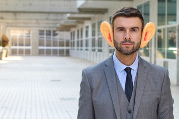 Big-eared businessman in office space 