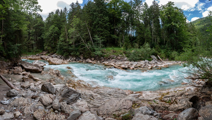 landscape with mountains, forest and a river in front. beautiful scenery