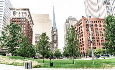 Century's old church in Downtown Cleveland's Public Square, with surrounding infrastructure and trees.