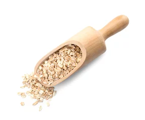 Gordijnen Scoop with raw oatmeal on white background. Healthy grains and cereals © New Africa