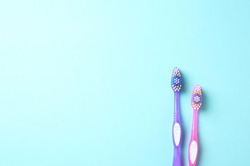 Manual toothbrushes on color background. Dental care