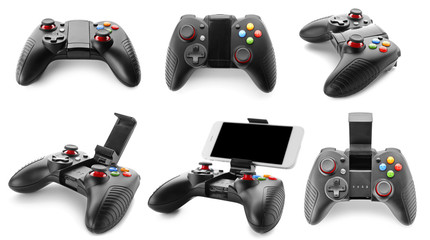 Set with video game controllers on white background