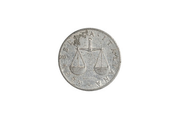 One Italian lire coin close-up from 1950s Italy, head side with libra icon. Isolated on white studio background. Archival collection coin of one lire value.