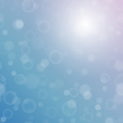 Vector bokeh texture on a bright two-tone blue-purple background. Festive abstract blur background.