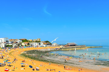 People enjoy the beach in Broastairs, Kent as the hot weather continues, England