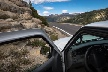 Open Truck Door Parked on Side Of Sierra Mountain Highway