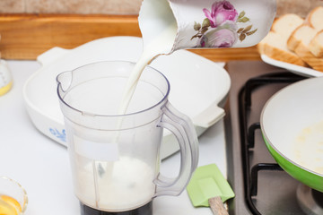 French toast preparation: Adding ingredients to prepare the mix to soak bread for french toasts