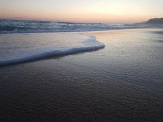 sunset sea waves foam splash  in summer Preveza Vrahos Greece