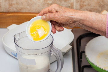 French toast preparation: Adding ingredients to prepare the mix to soak bread for french toasts