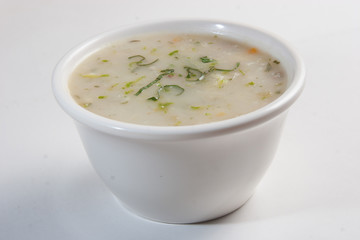 Chicken soup in a little dish.