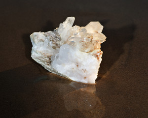 Himalayan Clear Quartz Laser Cluster on wet sand near the water on the beach at sunrise.