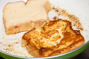 French toast preparation: Cooking french toasts on a pan