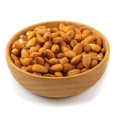 Almonds in wooden bowl isolated on a white background