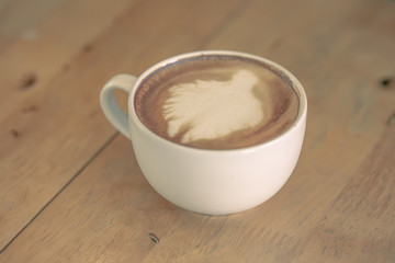 Coffee cup in coffee shop - vintage style effect picture.
