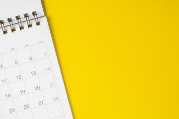 White clean calendar on solid yellow background with copy space, business, travel or project...