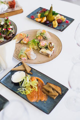 spring rolls in rice paper on festive table, stock photo image