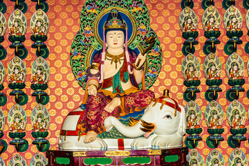 One hundred Buddha statues wall in Buddha Tooth Relic Temple in Singapore.