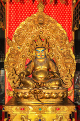 Yellow Dzambhala statue at Buddha Tooth Relic Temple, Singapore