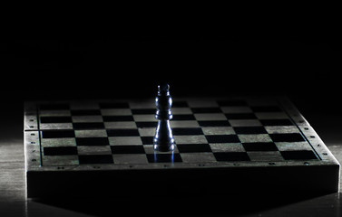 black king on a chessboard . photo with copy space