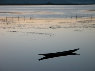 Peaceful lake with canoe in Inle Lake, Myanmar