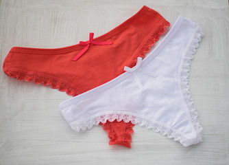 Red and white lingerie. Red and white lace thong on white background.