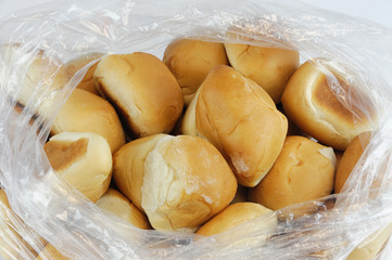close up on fresh baked dinner roll in the plastic bag