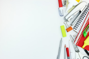 various office supplies and tools on white desk background with copy space