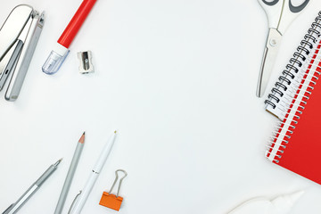 different stationary on table. office tools on white background. top view