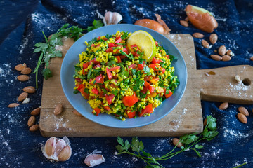 Tabbouleh. Levantine vegetarian salad with parsley tomatoes, mint, onion, bulgur, couscous, olive oil, lemon juice, salt and pepper. Vegan Arabian or Israeli traditional food served as part of meze