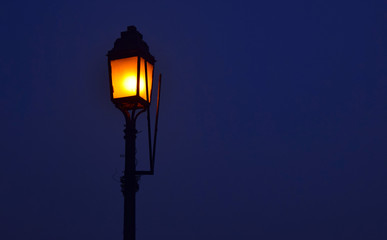 street light lamp in night with blue sky