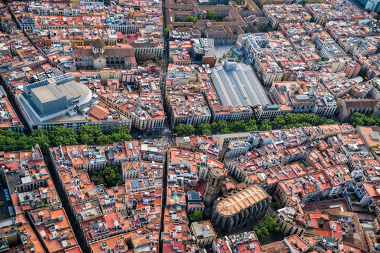 Aerial view of Barcelona Old Town narrow streets and famous La Rambla boardwalk, Spain