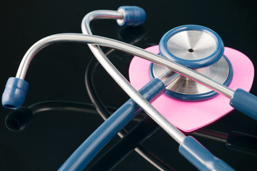 Medical concept. Stethoscope on the black background.