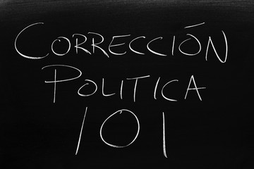 The words Corrección Política 101 on a blackboard in chalk.  Translation: Political Correctness 101