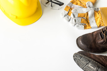 Construction site safety. Personal protective equipment on white background. Free space for text