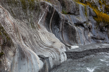 Rock remains of slow moving glacial ice, Franz Josef Glacier, New Zealand.