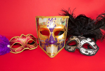 Carnival masks on a red background.