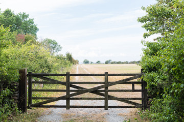 Fototapeta na wymiar Old gate by a country road