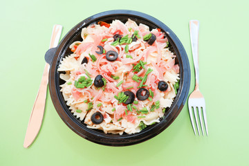 Italian cold salad with pasta of ham and olives