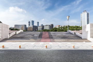 Panoramic skyline and modern business office buildings with empty road,empty concrete square floor