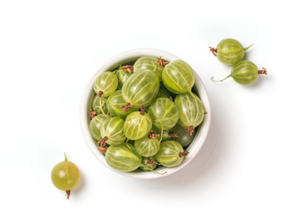 View from above of ripe green gooseberry in small bowl on white background. Organic gooseberries isolated on white with clipping path. Top view or flat lay. Copy space for text